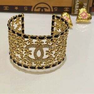 CHANEL Gold and Black Flower Filigree Cuff Bracelet with Crystal CC